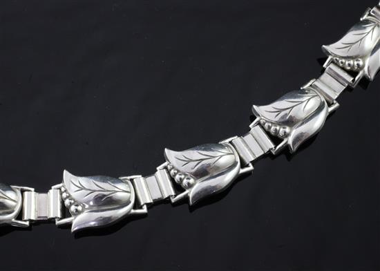 A Georg Jensen sterling silver stylised leaf and berry link bracelet, 6.75in.